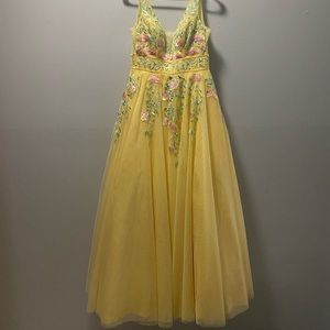 Beautiful Yellow with Spring colored flowers, great for prom.